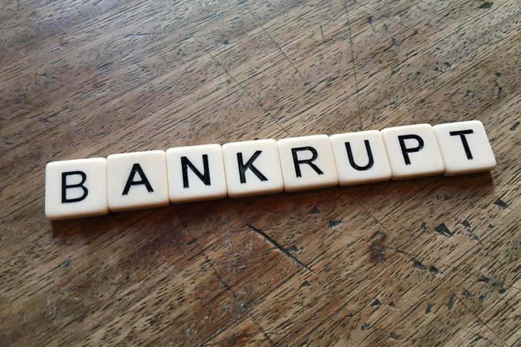 Bankrupt spelled in scrabble tiles.